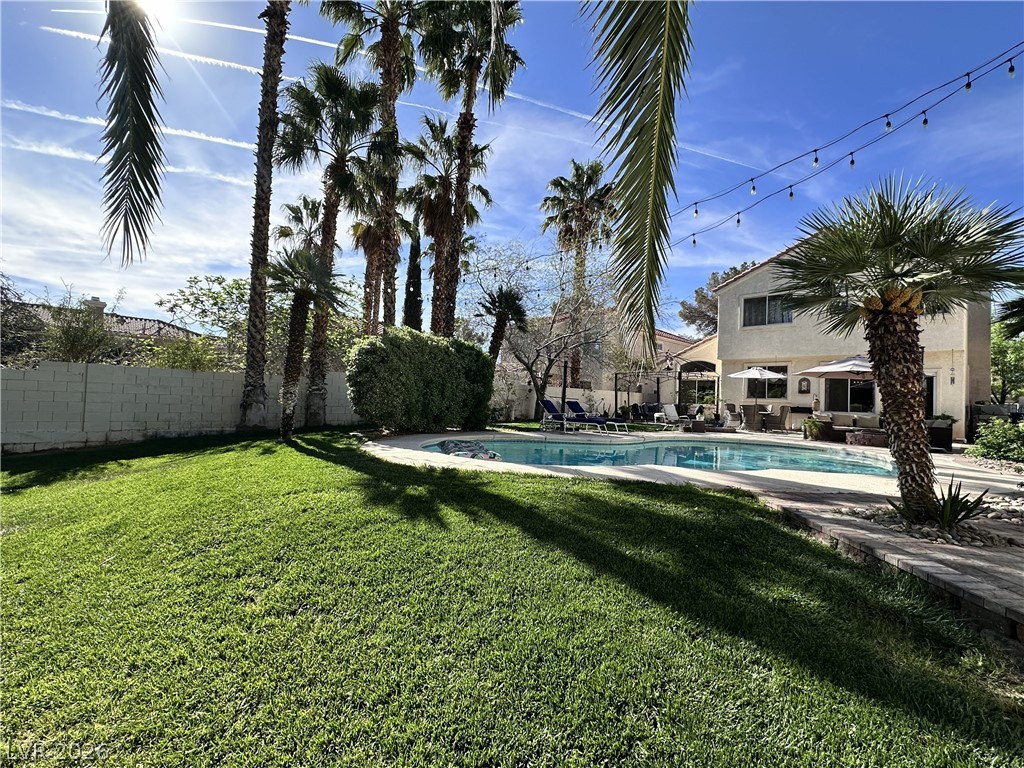 9724 Trail Rider Drive Las Vegas, NV 89117 - Photo 7 of 52 Fenced yard with a patio
