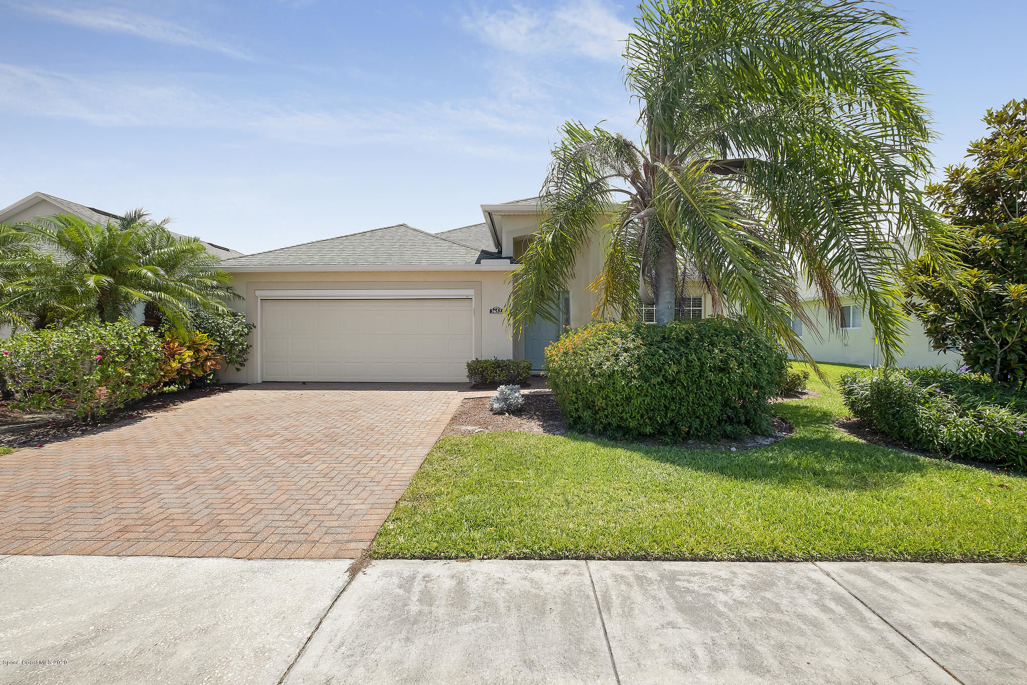 3652 Shawnee Lane Melbourne, FL 32901 - Photo 2 of 34 a front view of a house with a yard and potted plants