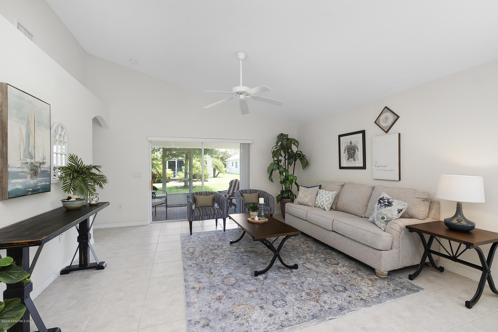 3652 Shawnee Lane Melbourne, FL 32901 - Photo 11 of 34 a living room with furniture and a large window