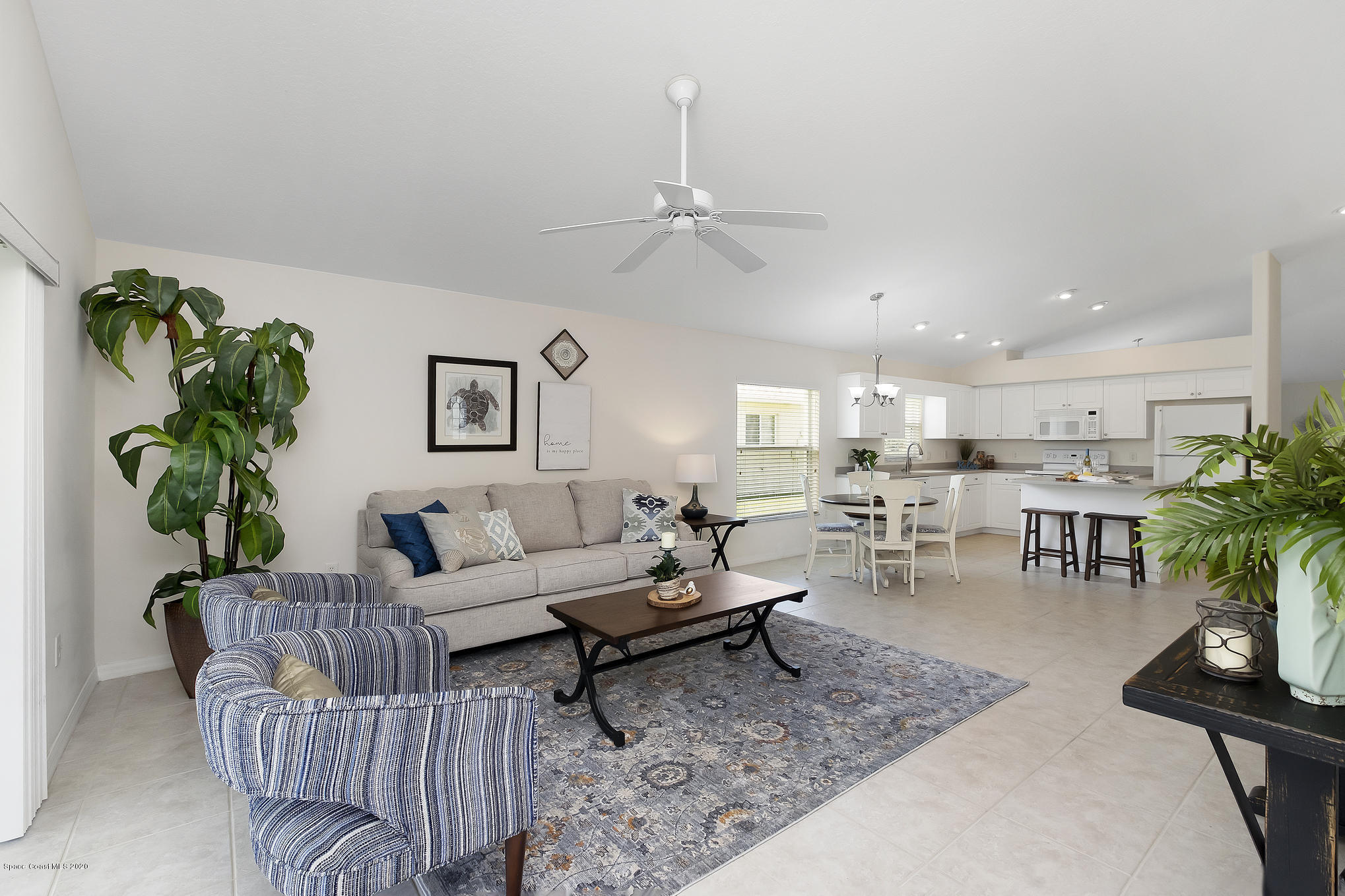 3652 Shawnee Lane Melbourne, FL 32901 - Photo 12 of 34 a living room with furniture and a potted plant