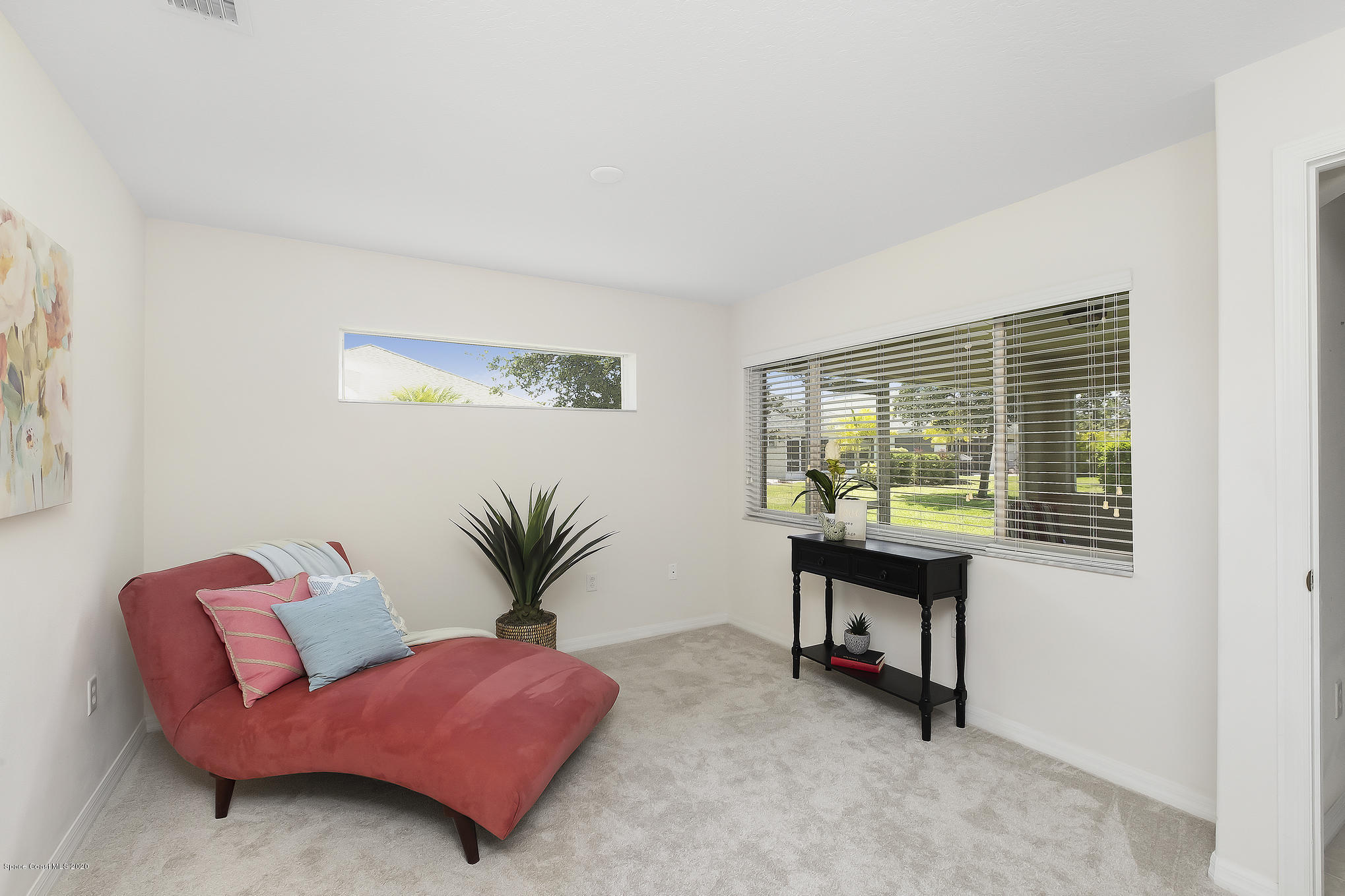 3652 Shawnee Lane Melbourne, FL 32901 - Photo 13 of 34 a living room with furniture and a potted plant