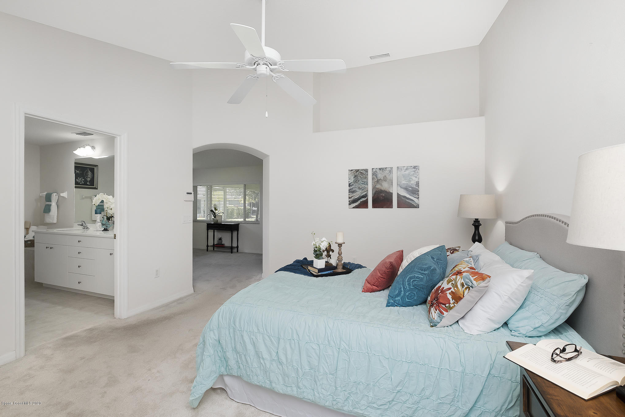 3652 Shawnee Lane Melbourne, FL 32901 - Photo 15 of 34 a bedroom with a bed and furniture