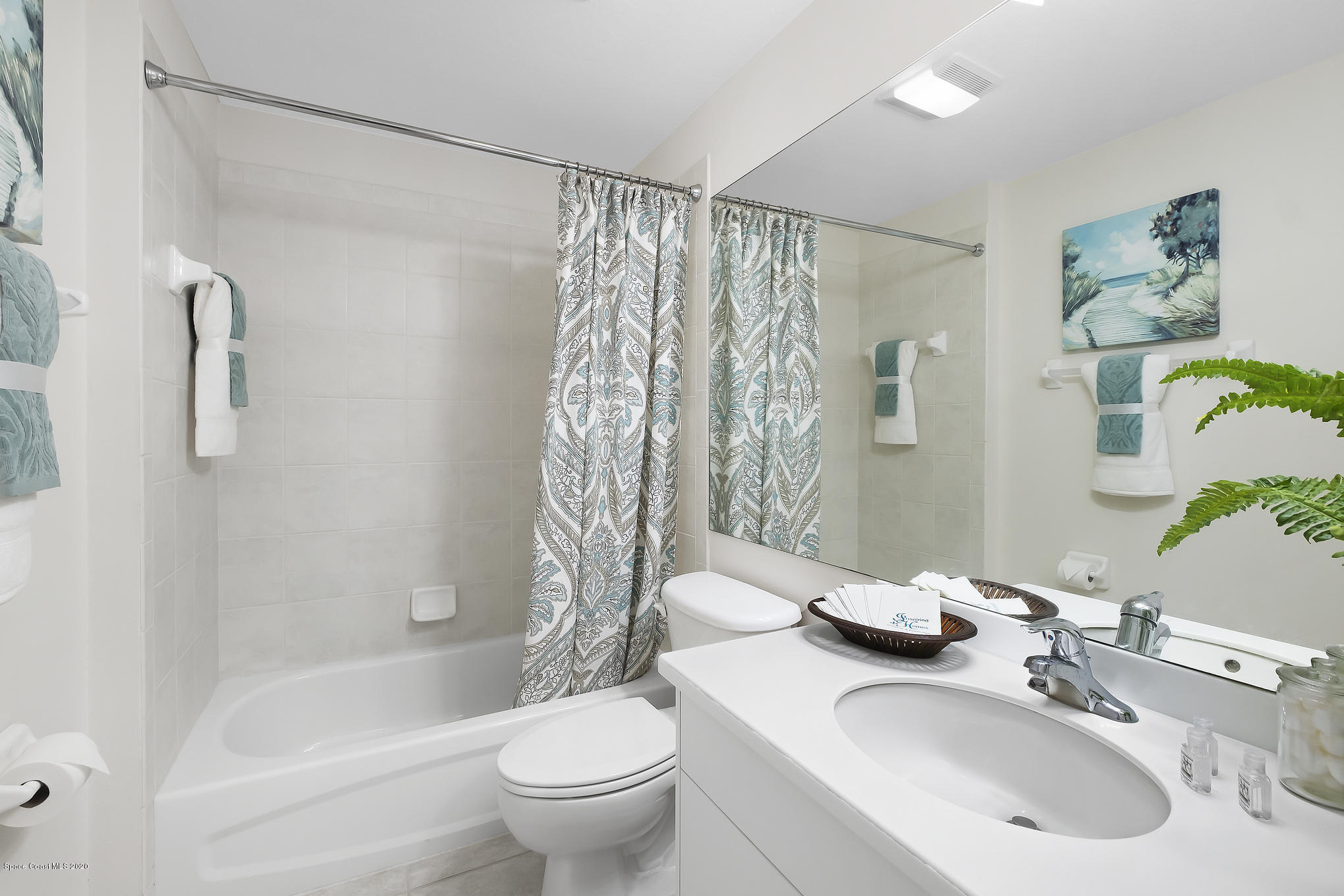 3652 Shawnee Lane Melbourne, FL 32901 - Photo 21 of 34 a bathroom with a sink toilet and shower