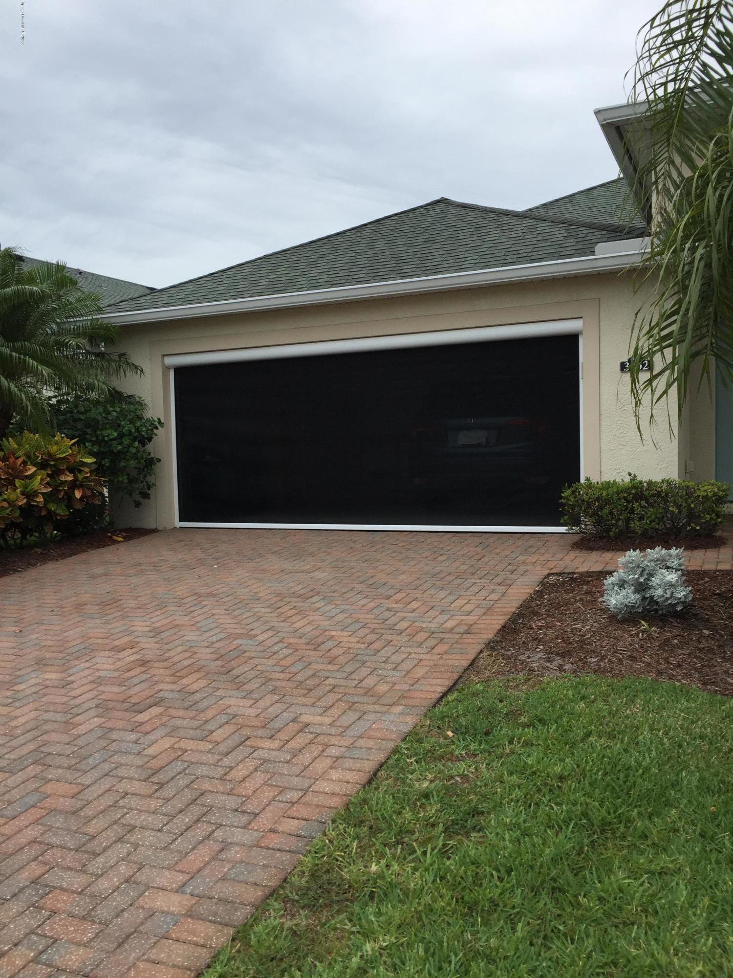 3652 Shawnee Lane Melbourne, FL 32901 - Photo 23 of 34 a front view of a house with a yard