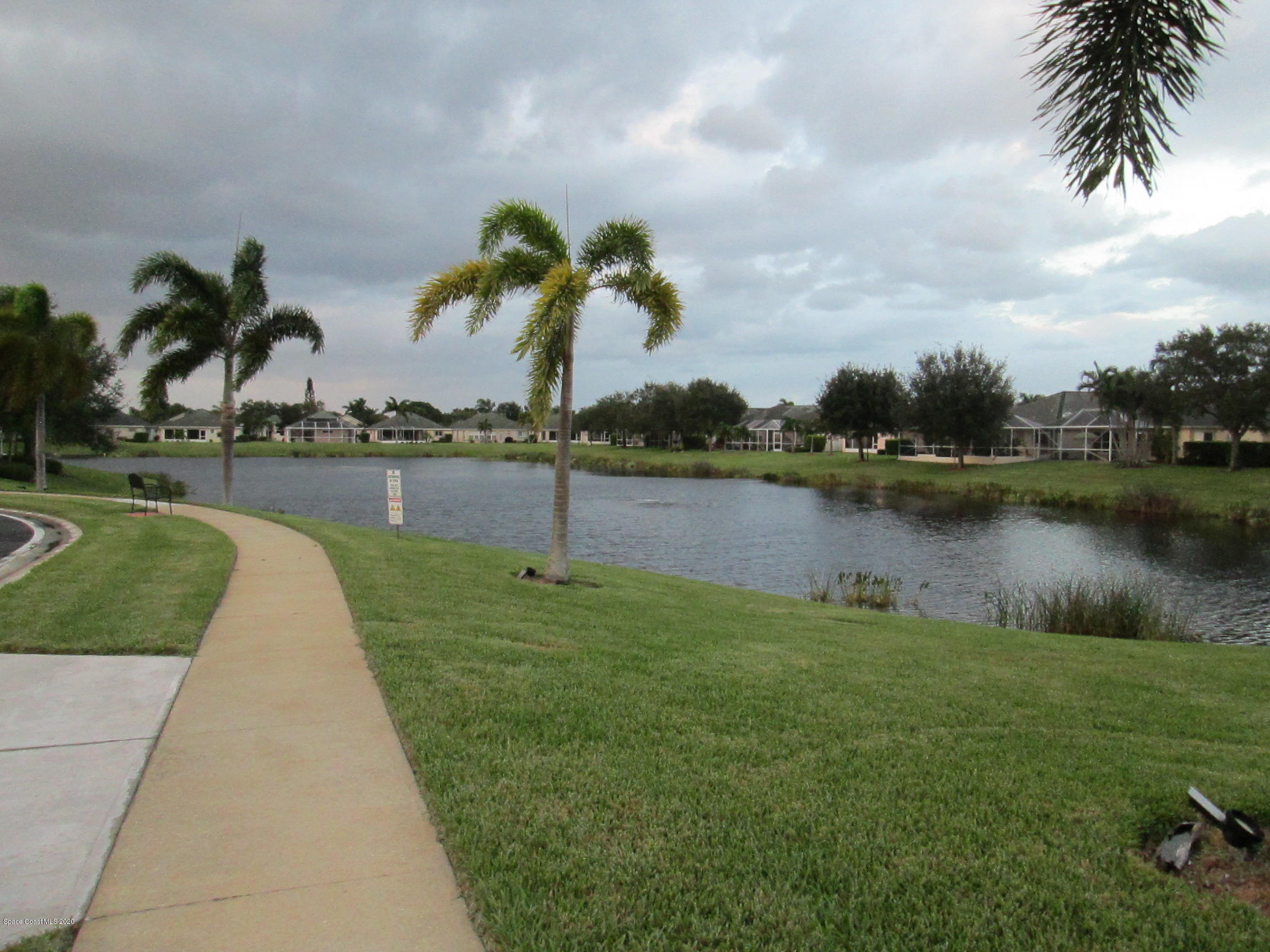 3652 Shawnee Lane Melbourne, FL 32901 - Photo 26 of 34 a view of a lake and a yard