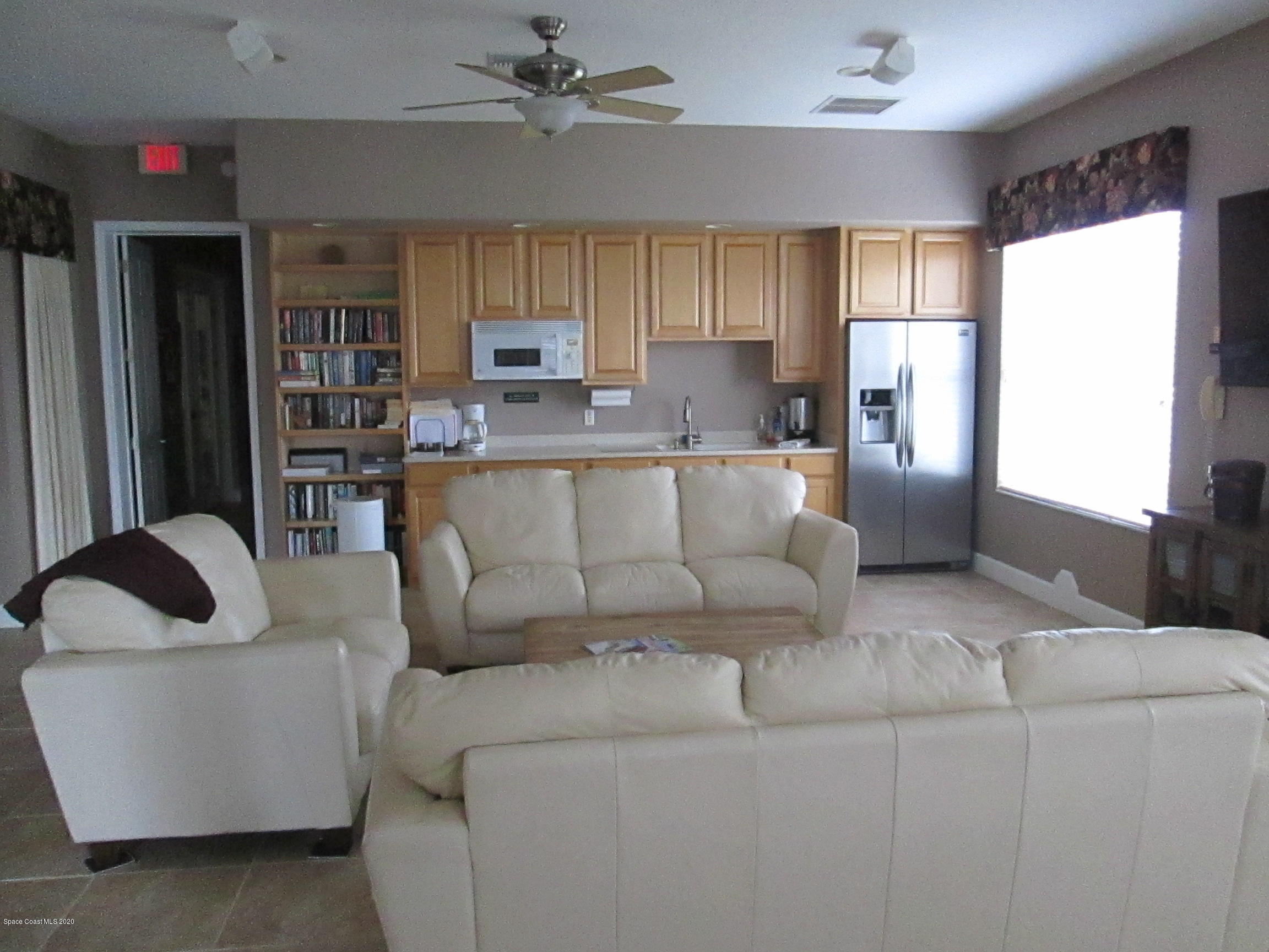 3652 Shawnee Lane Melbourne, FL 32901 - Photo 32 of 34 a living room with furniture and a window