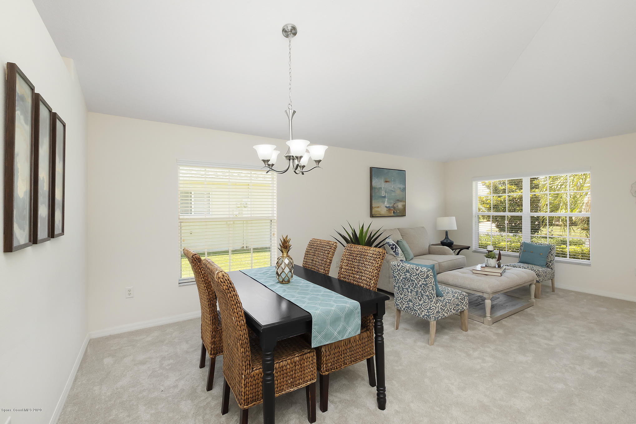 3652 Shawnee Lane Melbourne, FL 32901 - Photo 5 of 34 a living room with furniture and a chandelier