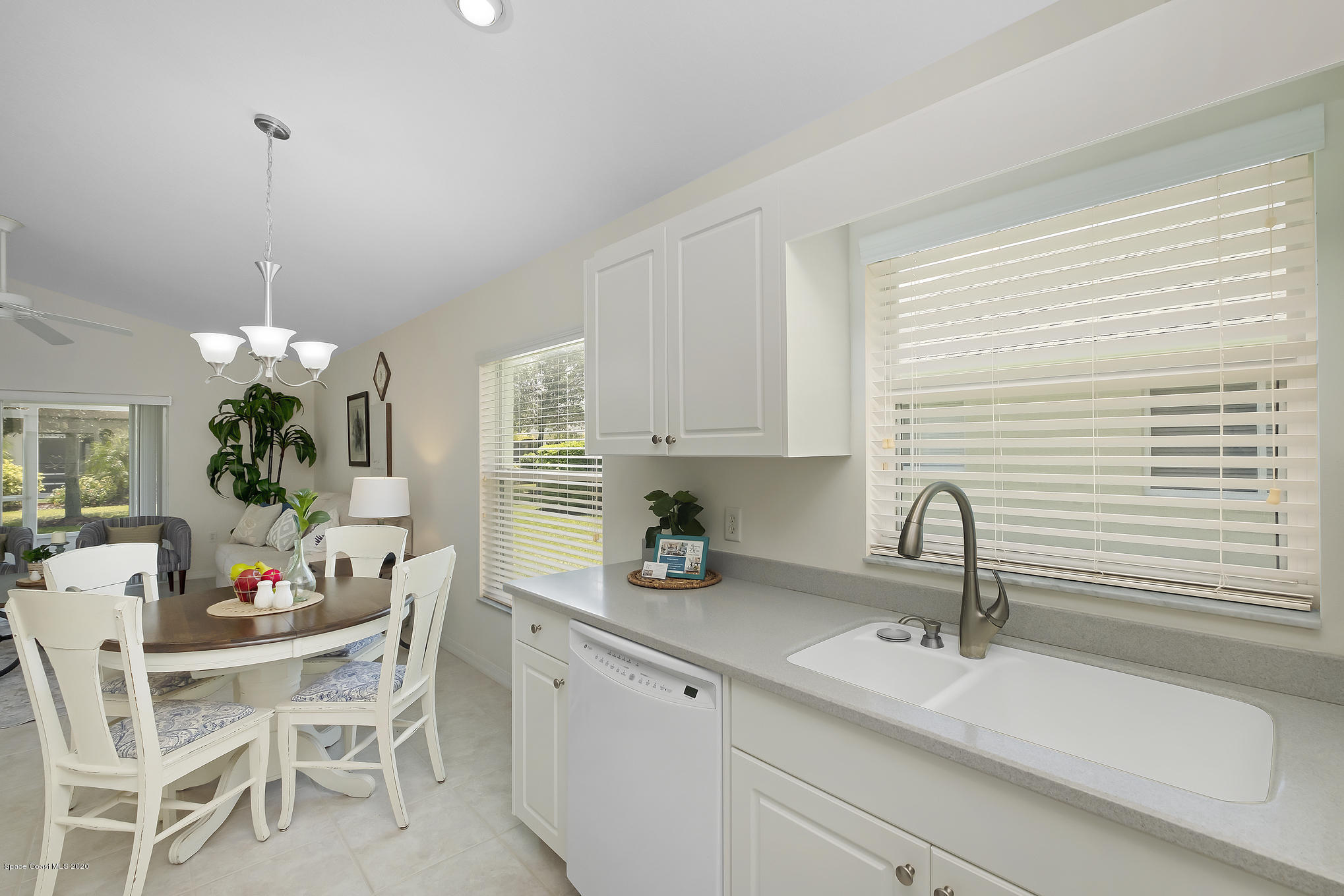 3652 Shawnee Lane Melbourne, FL 32901 - Photo 8 of 34 a kitchen with a sink cabinets and window