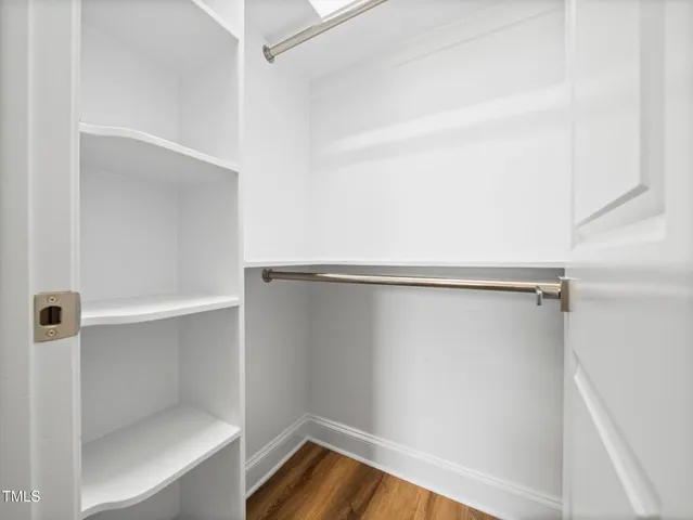 wooden floor in an empty walk in closet