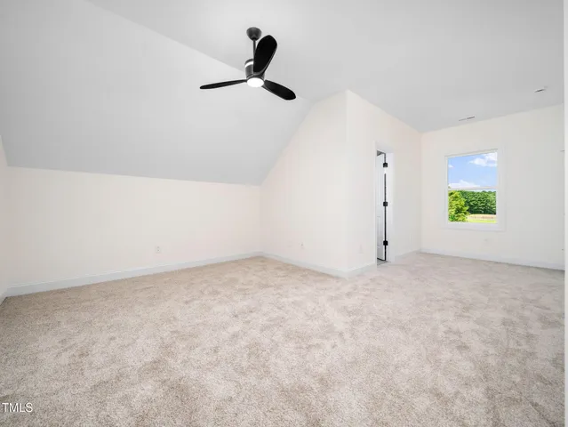 a view of an empty room and a window