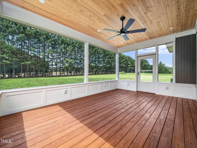 a view of outdoor space with wooden floor and city view