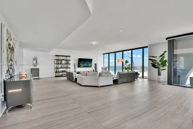 a dining room with furniture window and wooden floor