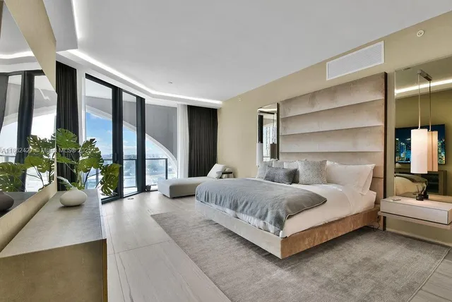 a living room with furniture potted plant and a window