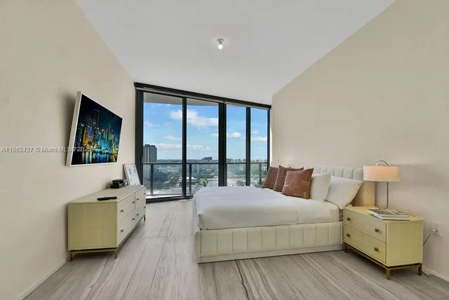 a roof deck with couch and city view