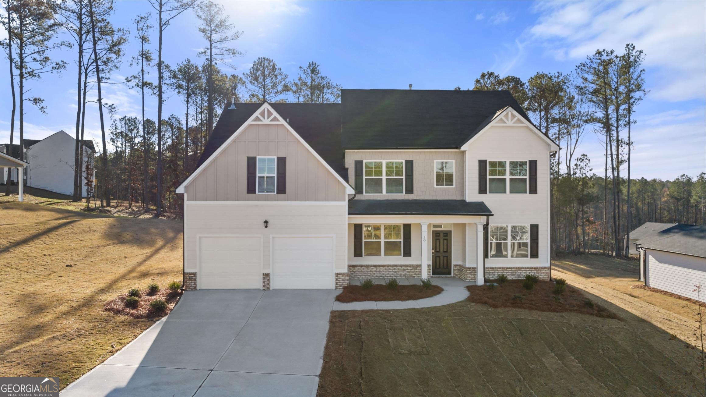 771 Ralph Still Road, Unit 48 Dacula, GA 30019 - Photo 1 of 1 a view of a big house with a big yard and large trees