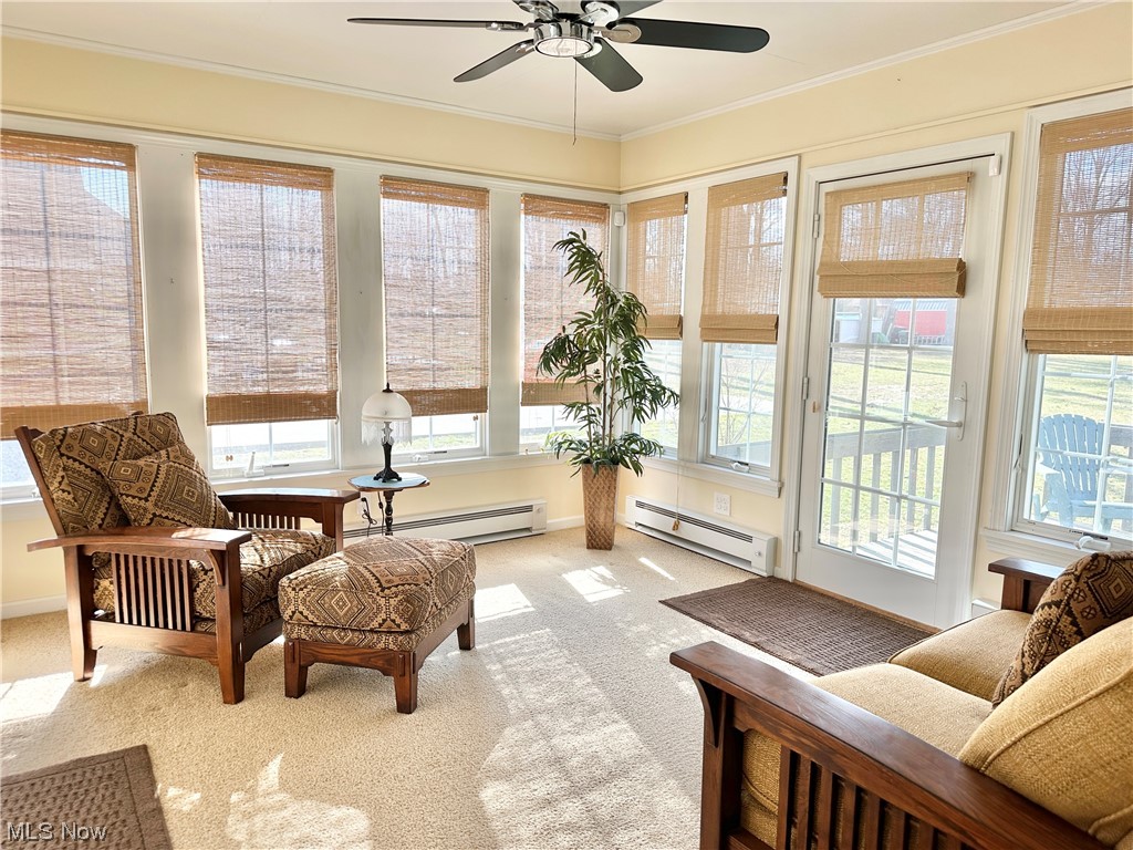 6130 Renninger Road New Franklin, OH 44319 - Photo 5 of 30 Sunroom featuring Anderson windows, baseboard heating & ceiling fan