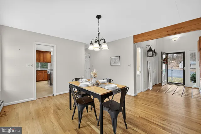 a kitchen with stainless steel appliances granite countertop wooden cabinets a granite counter top and a sink