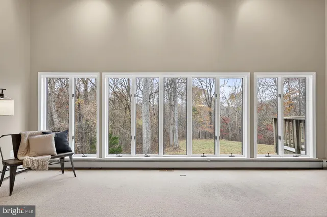 a kitchen with a table chairs refrigerator and microwave