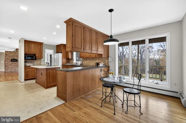 an empty room with a ceiling fan and a window