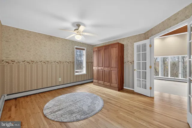 a bathroom with a tub sink shower and mirror