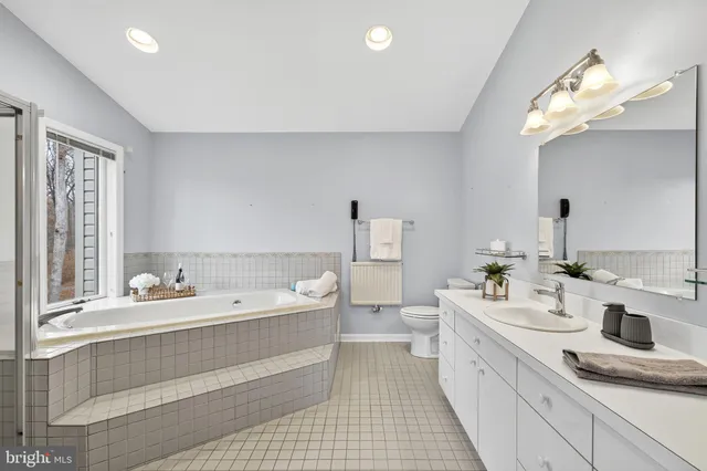 a view of a house with a deck and furniture