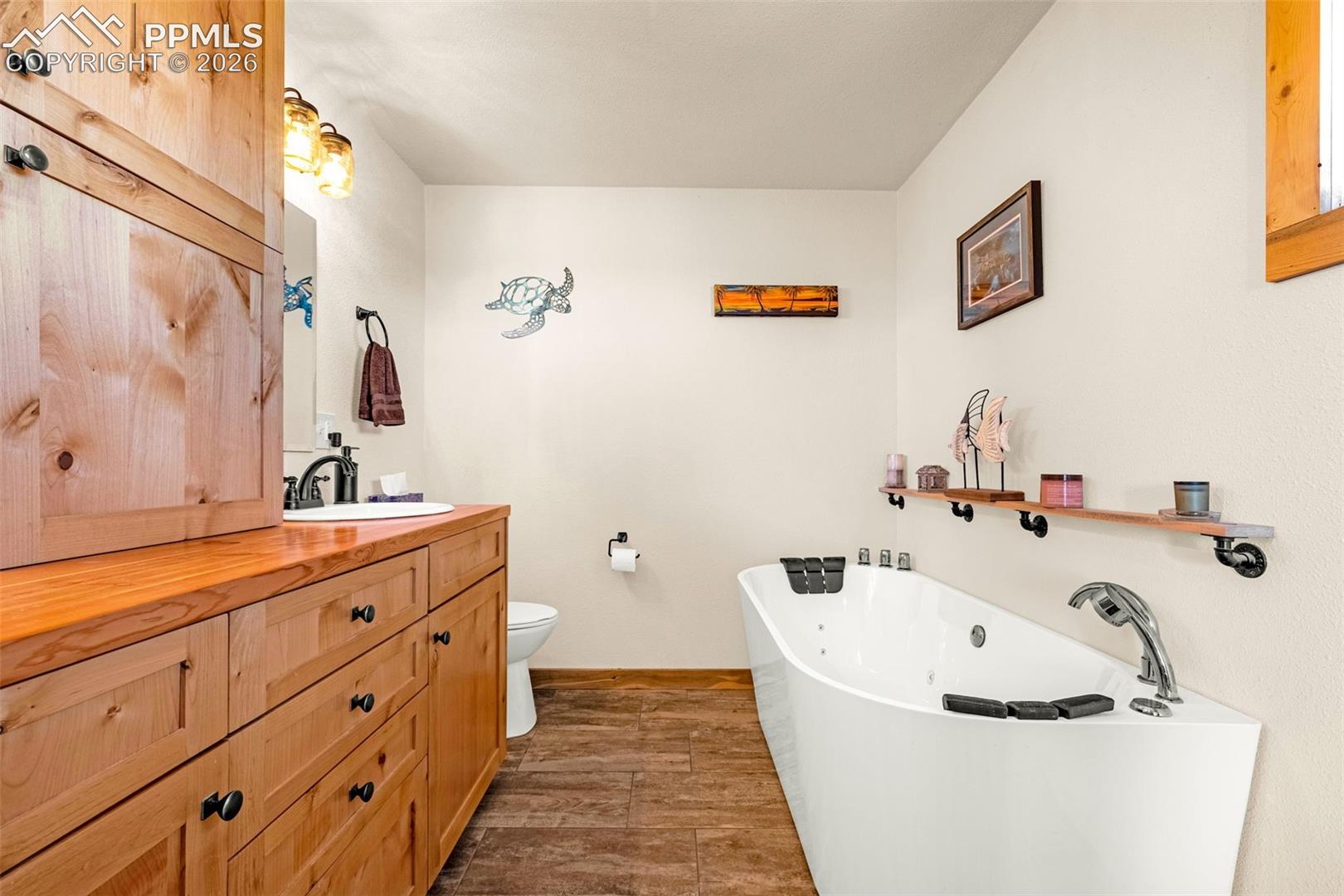 8480 Delaware Road Colorado Springs, CO 80926 - Photo 14 of 50 Primary bathroom with jetted tub and double vanity