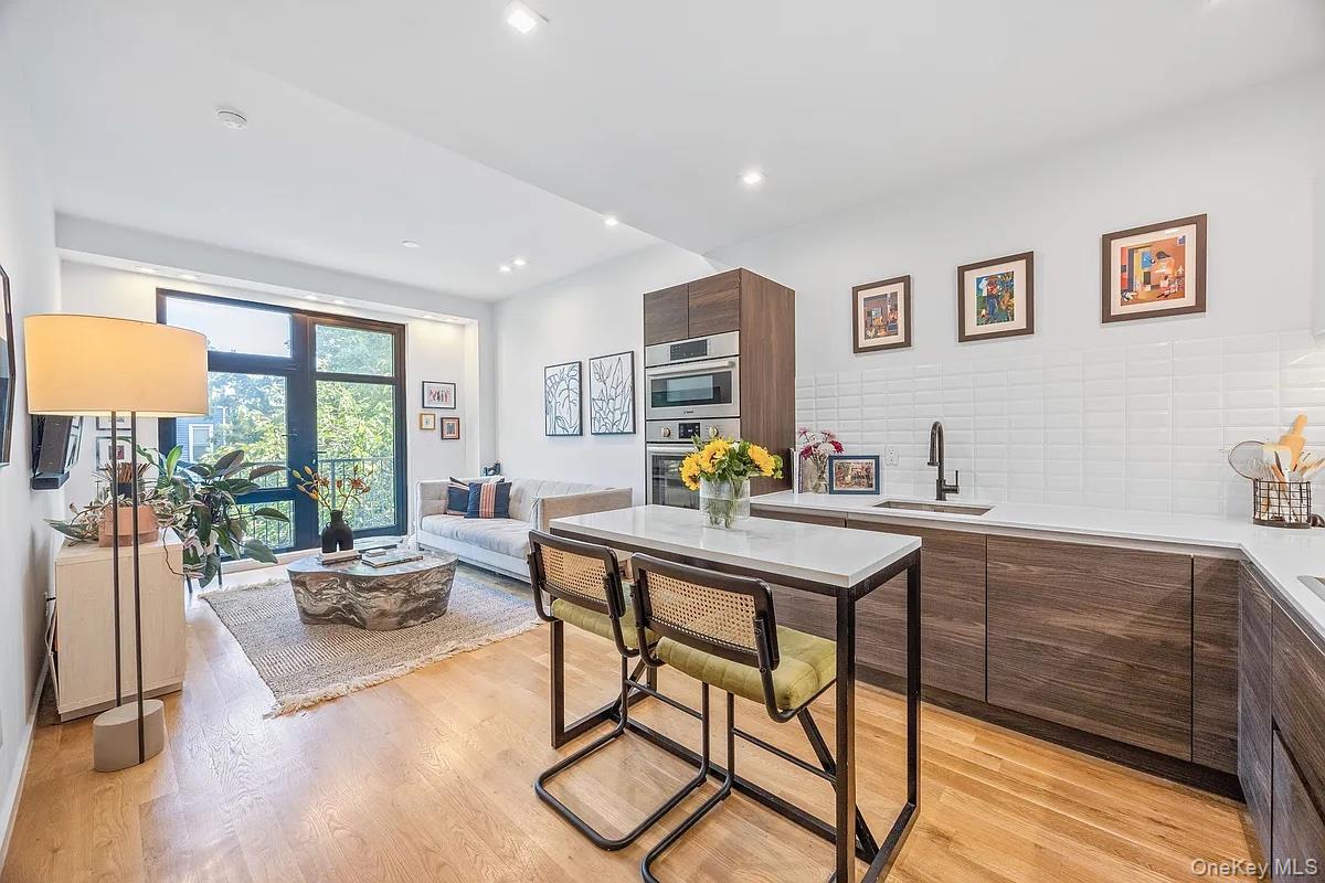 1110 Madison Street, Unit 3B Brooklyn, NY 11221 - Photo 2 of 11 a view of a workspace with furniture window and outside view