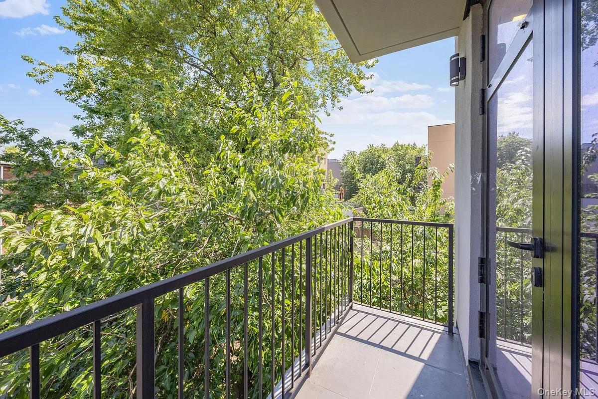 1110 Madison Street, Unit 3B Brooklyn, NY 11221 - Photo 8 of 11 a view of a balcony with wooden floor