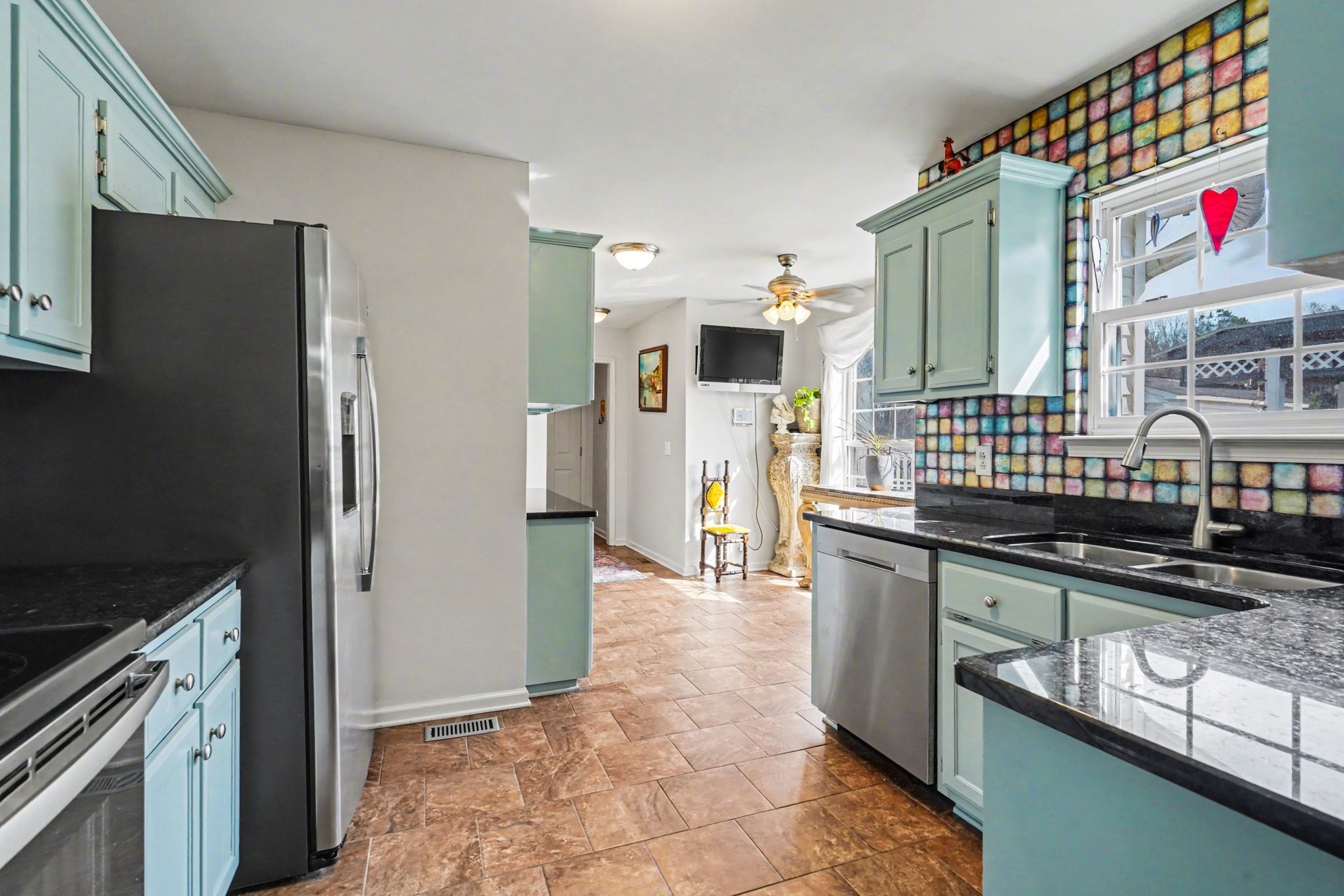 1510 Rapids Road Portland, TN 37148 - Photo 14 of 33 a kitchen with stainless steel appliances granite countertop a refrigerator and a stove