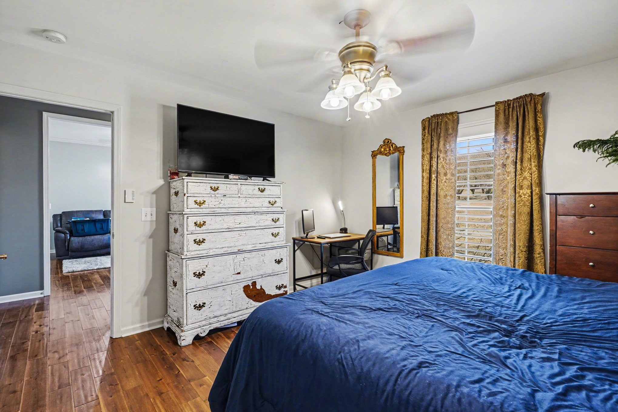 1510 Rapids Road Portland, TN 37148 - Photo 21 of 33 a bedroom with a bed and a flat tv screen on dresser