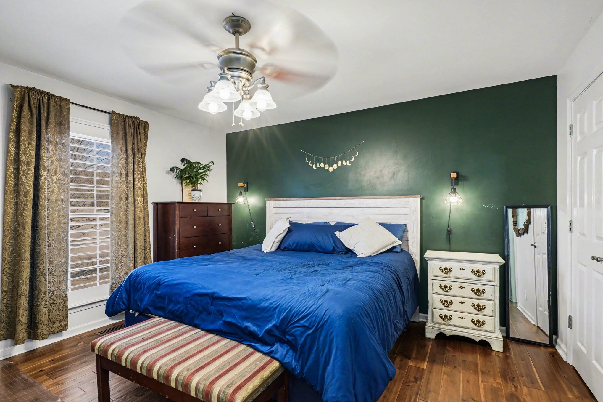 1510 Rapids Road Portland, TN 37148 - Photo 22 of 33 a bedroom with a bed and a flat tv screen on dresser