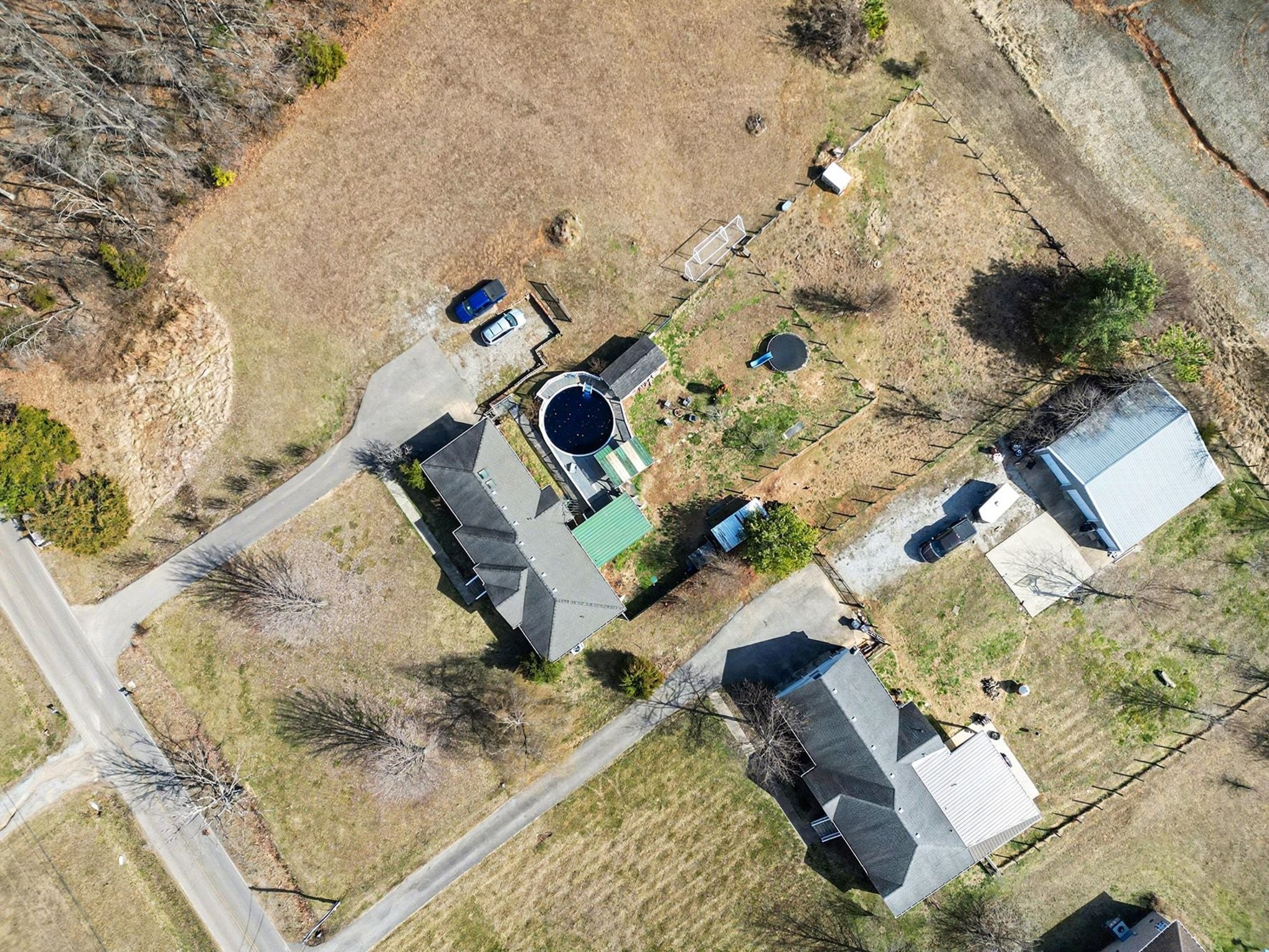 1510 Rapids Road Portland, TN 37148 - Photo 31 of 33 an aerial view of a house with a yard and large trees