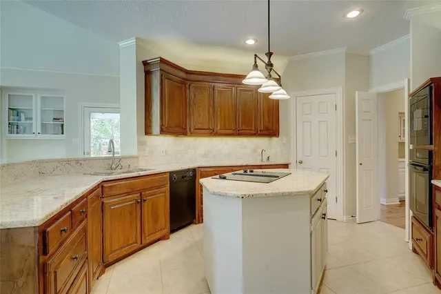 a kitchen with a sink stove and refrigerator