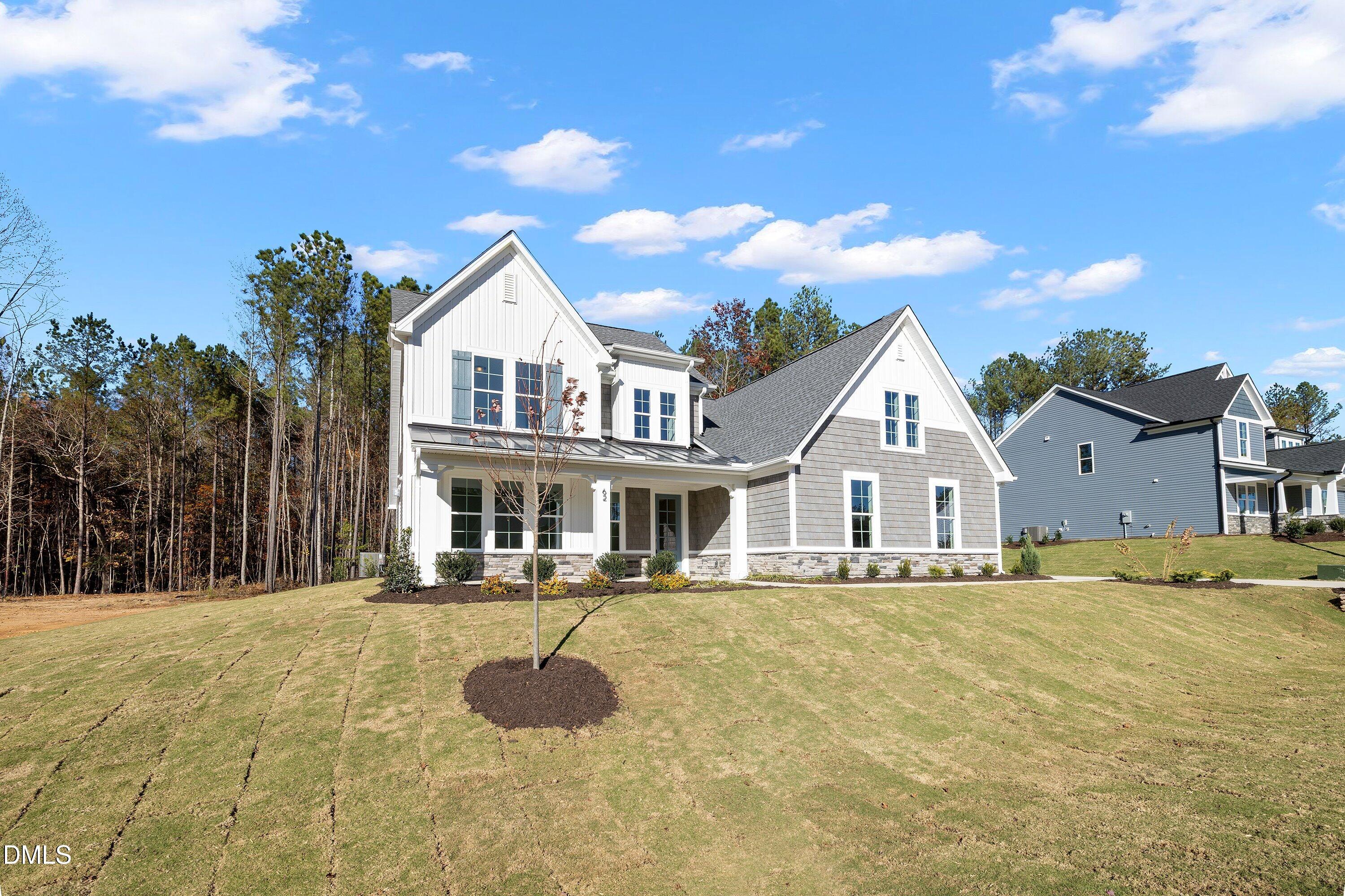 62 West Victoria Ridge Drive, Unit 19 Selma, NC 27576 - Photo 22 of 26 a front view of a house with a yard