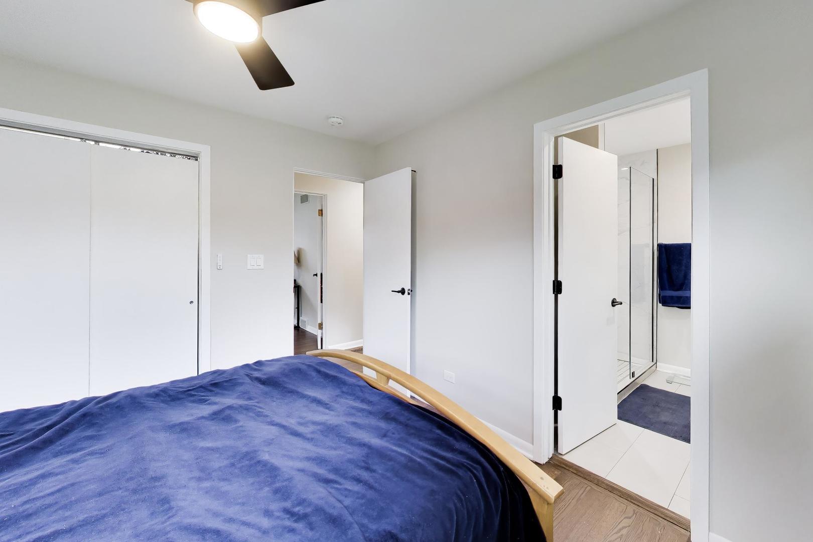 108 West Sunset Road Mount Prospect, IL 60056 - Photo 17 of 40 a bedroom with a bed and a shower
