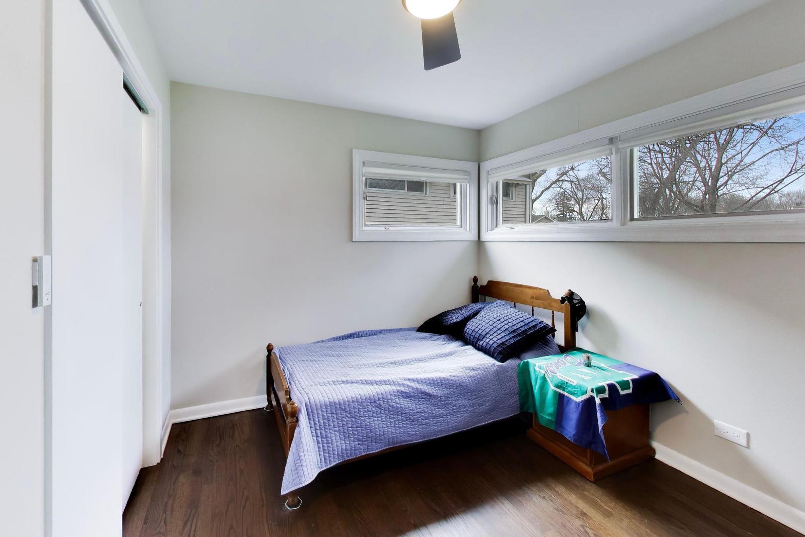 108 West Sunset Road Mount Prospect, IL 60056 - Photo 19 of 40 a bedroom with a bed and a window