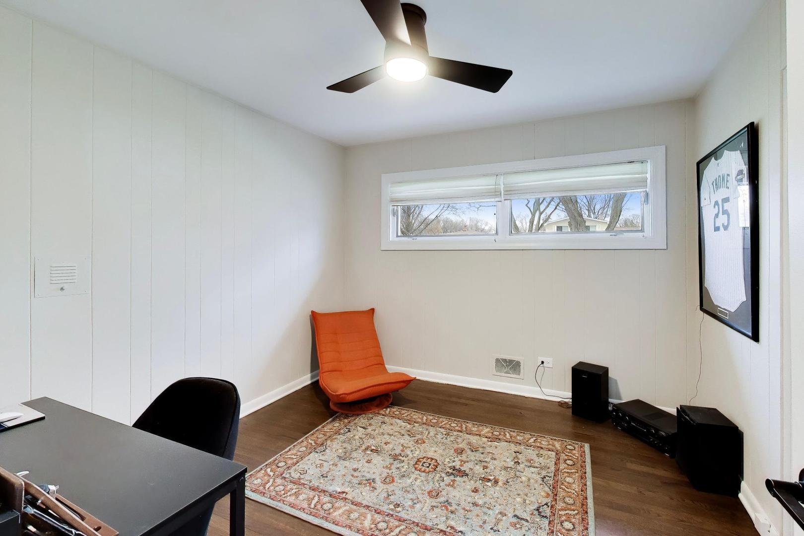 108 West Sunset Road Mount Prospect, IL 60056 - Photo 21 of 40 a bedroom with a bed and lamp