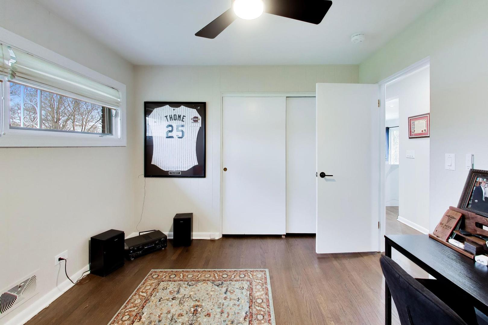 108 West Sunset Road Mount Prospect, IL 60056 - Photo 22 of 40 a bedroom with furniture and a window