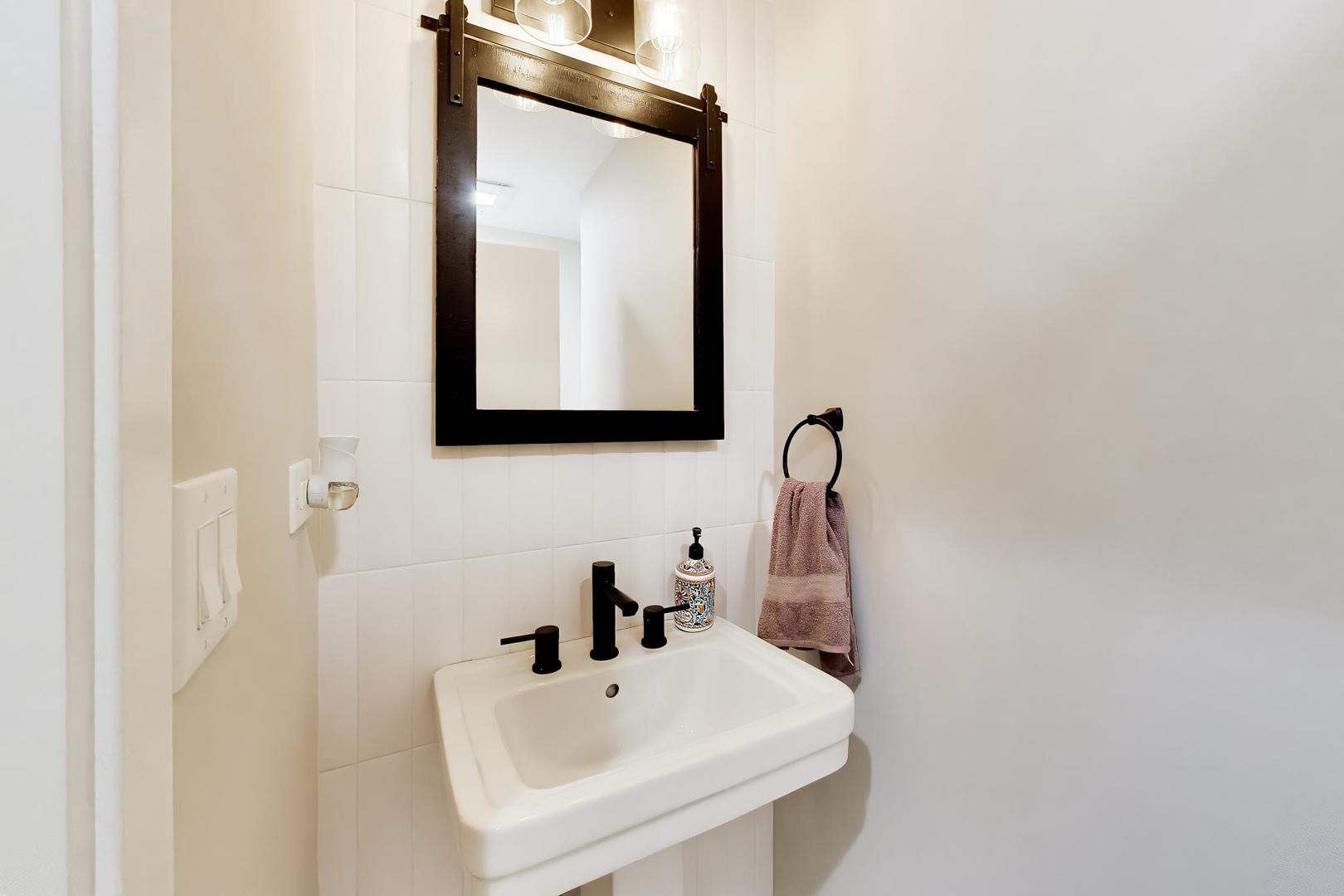 108 West Sunset Road Mount Prospect, IL 60056 - Photo 23 of 40 a bathroom with a sink and a mirror