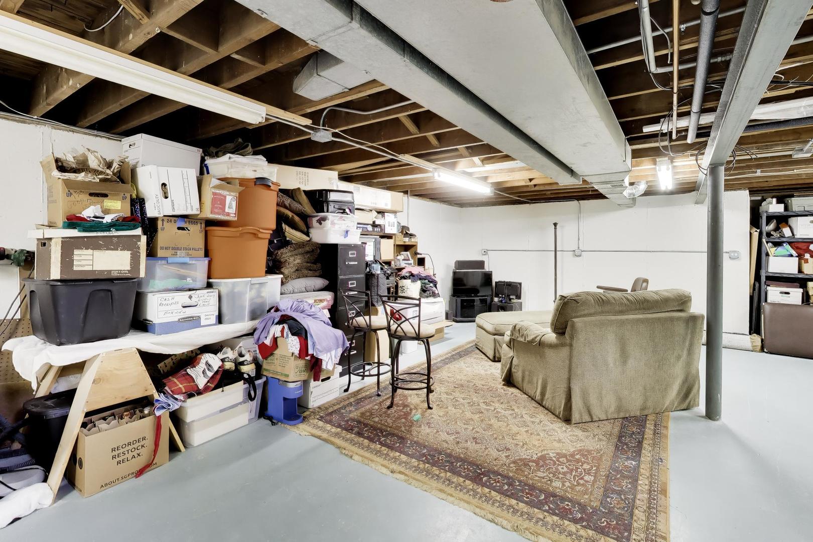 108 West Sunset Road Mount Prospect, IL 60056 - Photo 26 of 40 a storage room with lots of furniture and clutter