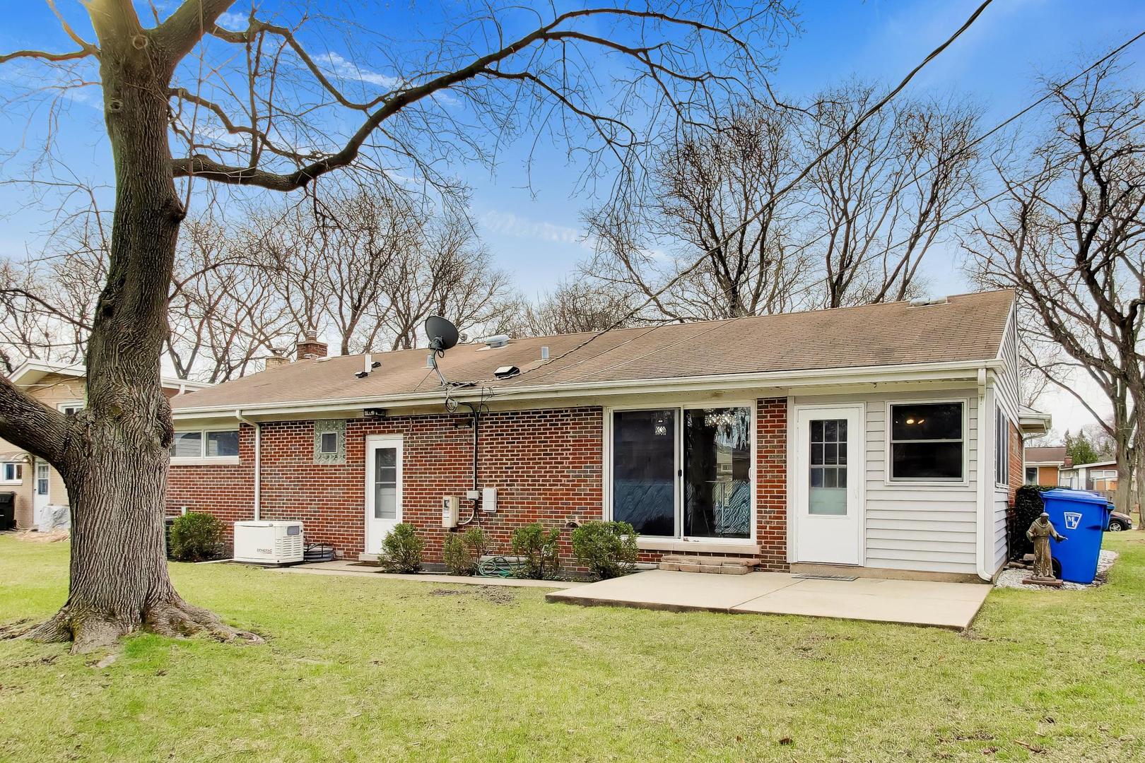108 West Sunset Road Mount Prospect, IL 60056 - Photo 32 of 40 front view of a house with a yard