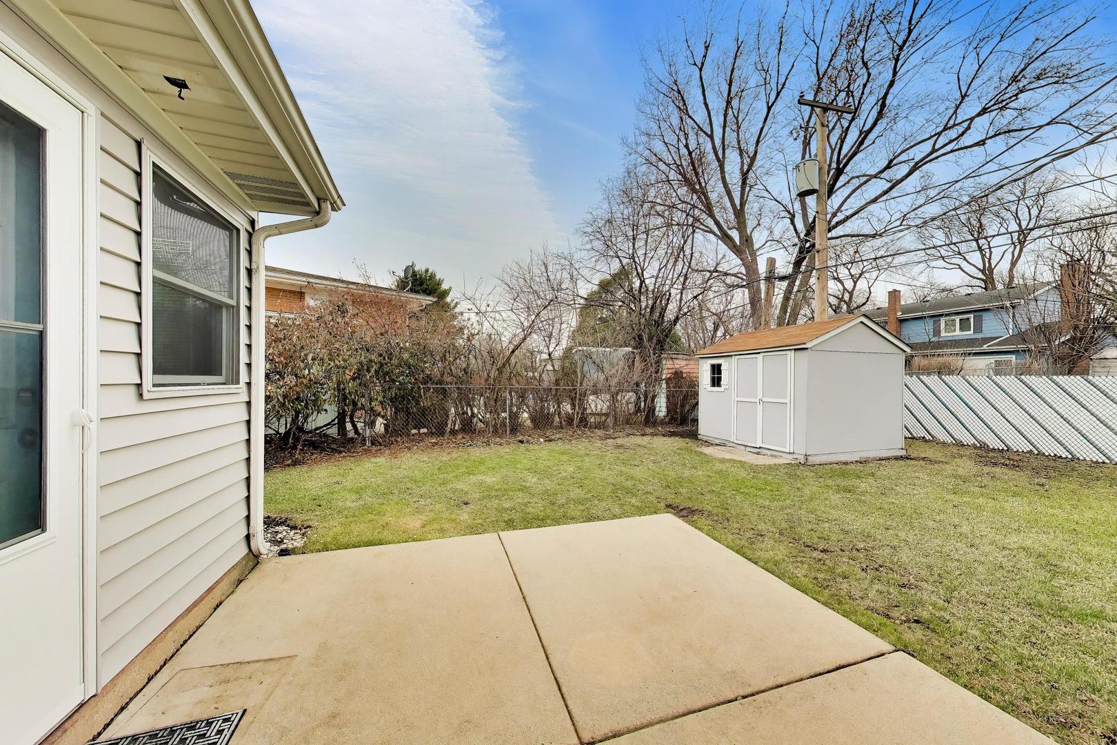 108 West Sunset Road Mount Prospect, IL 60056 - Photo 34 of 40 a view of backyard of house and trees