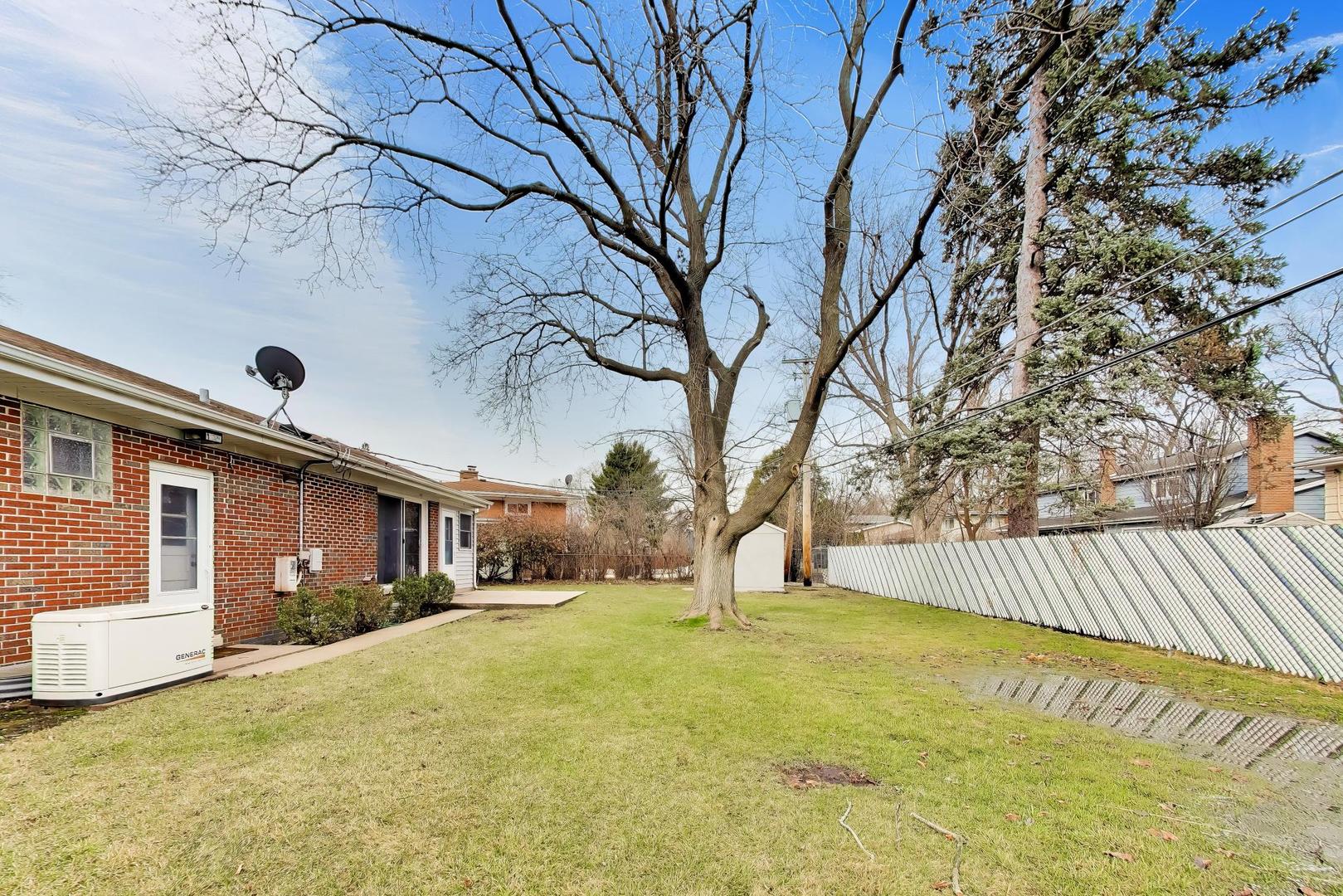 108 West Sunset Road Mount Prospect, IL 60056 - Photo 37 of 40 a view of house with backyard and tree