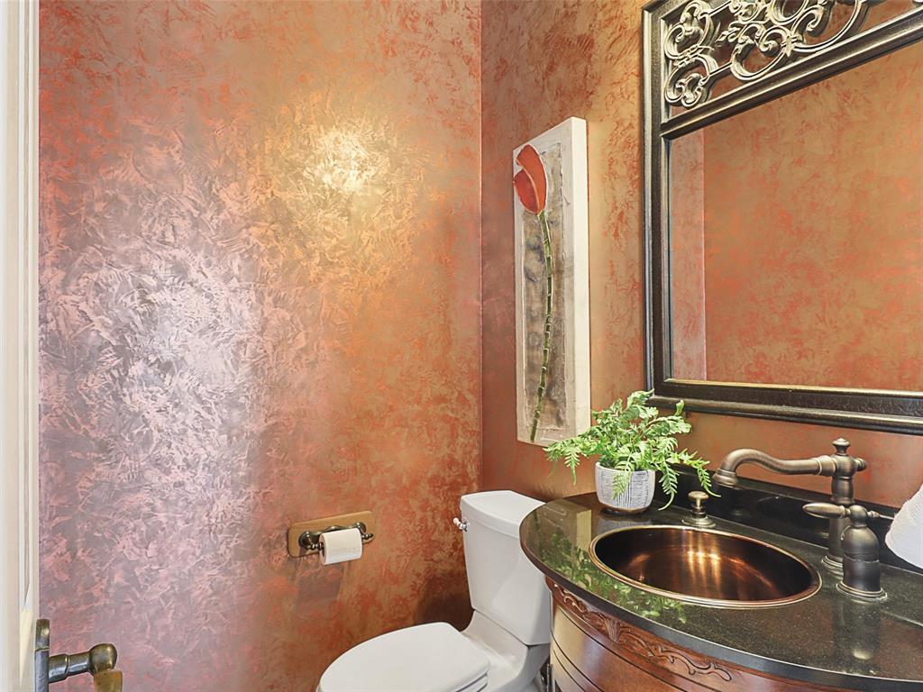 723 Bent Tree Court Coppell, TX 75019 - Photo 19 of 39 a bathroom with a sink and toilet