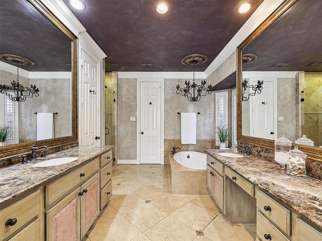 723 Bent Tree Court Coppell, TX 75019 - Photo 22 of 39 a spacious bathroom with a granite countertop tub sink and mirror