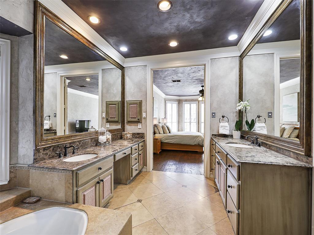 723 Bent Tree Court Coppell, TX 75019 - Photo 23 of 39 a spacious bathroom with a granite countertop sink and a mirror