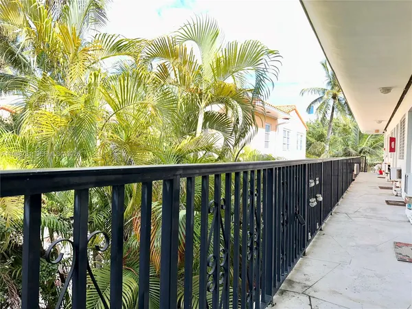 a view of balcony with wooden floor