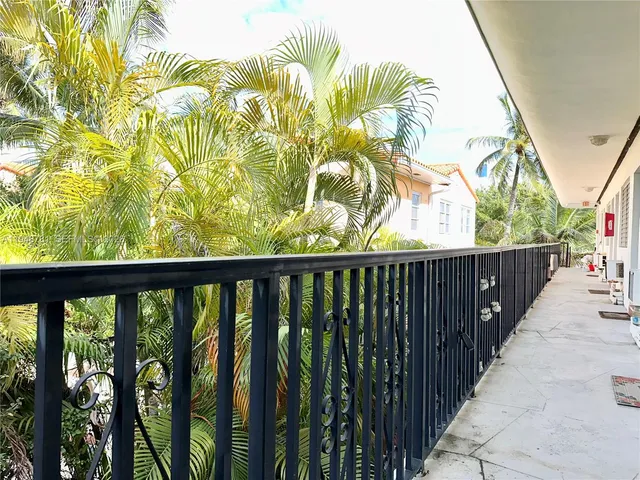 a view of balcony with wooden floor