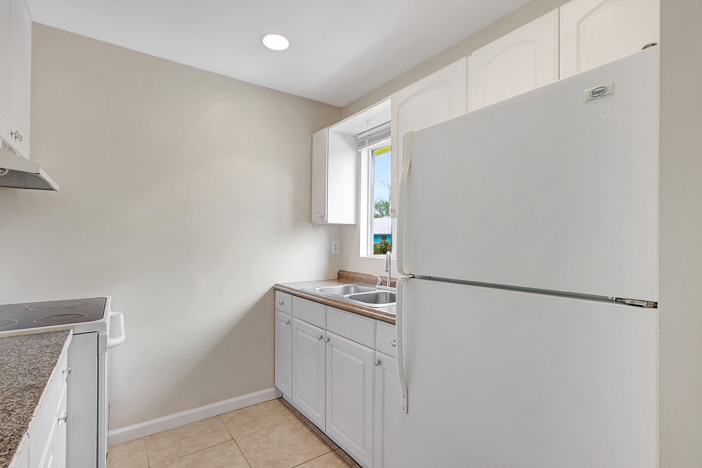 4669-4667 Southeast Salvatori Road Stuart, FL 34997 - Photo 36 of 52 Left Kitchen