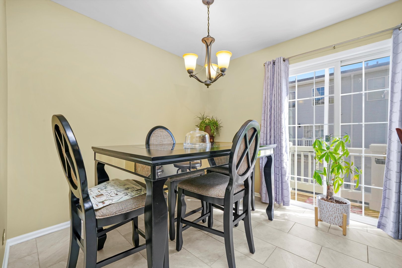 284 Holiday Lane Hainesville, IL 60073 - Photo 11 of 34 a view of a dining room with furniture and a potted plant